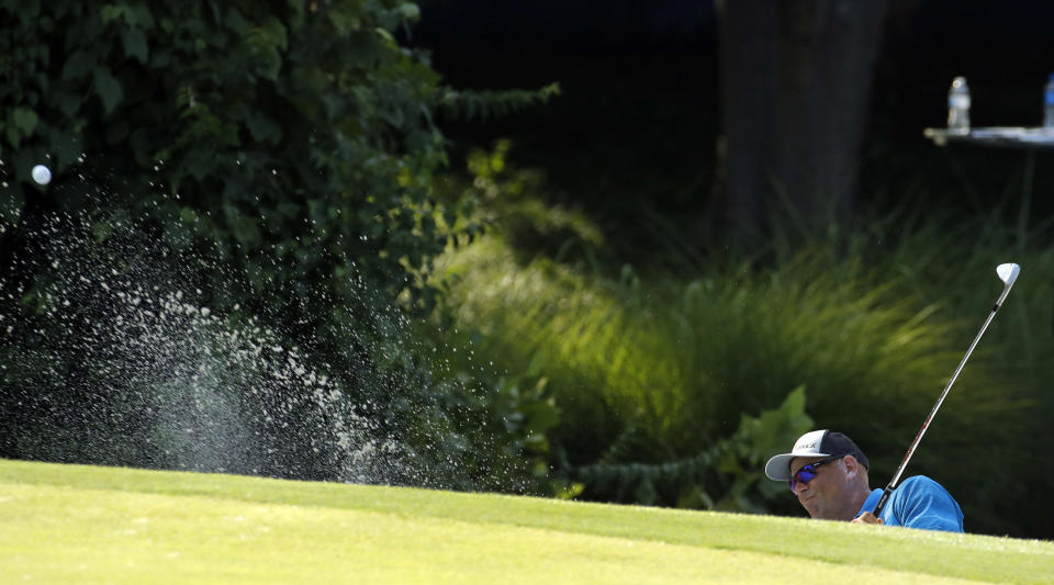 Stewart Cink hits out of a bunker on the 17th hole during the third round of the PGA Championship golf tournament at Bellerive Country Club, Saturday, Aug. 11, 2018, in St. Louis. (AP Photo/Charlie Riedel)