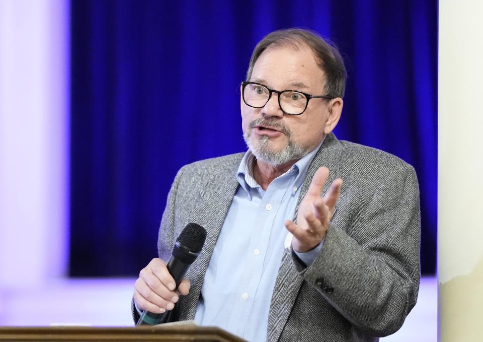 Tom Mauser talks during a vigil remembering the 25th anniversary of the Columbine High School mass shooting, Friday, April 19, 2024, in Denver. (AP Photo/Jack Dempsey)