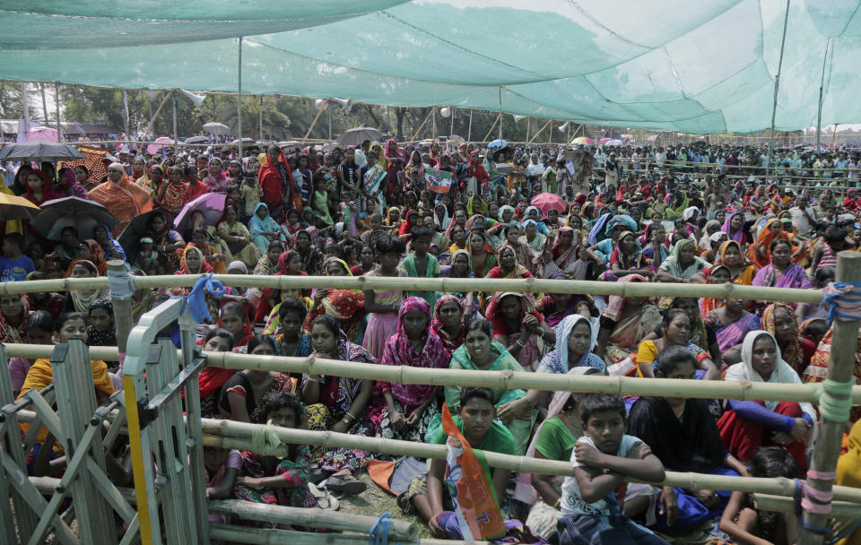 Supporters of Trinamool Congress party attend an election rally addressed by party leader and Chief Minister of West Bengal state Mamata Banerjee at Anchana in Mathurapur, about 60 kilometers south of Kolkata, India, Thursday, May 16, 2019. With 900 million of India's 1.3 billion people registered to vote, the Indian national election is the world's largest democratic exercise. The seventh and last phase of the elections will be held on Sunday. (AP Photo/Bikas Das)