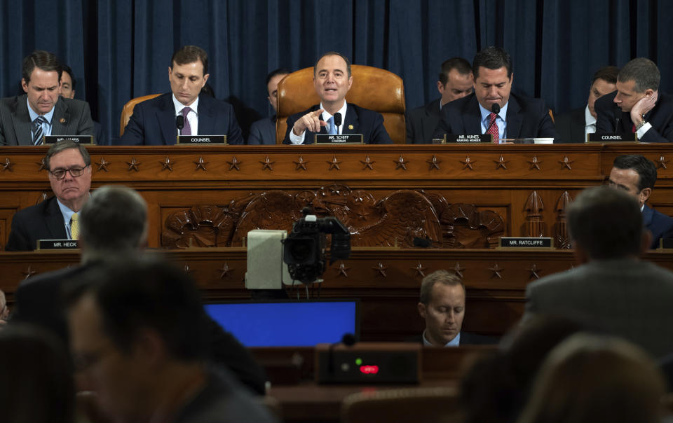 House Intelligence Committee Chairman Adam Schiff of Calif., center, speaks during the House Intelligence Committee on Capitol Hill in Washington, Wednesday, Nov. 13, 2019, in the first public impeachment hearing of President Donald Trump's efforts to tie U.S. aid for Ukraine to investigations of his political opponents. (Saul Loeb/Pool Photo via AP)