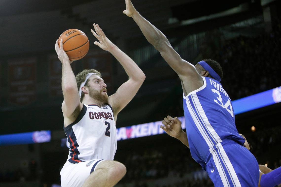 Gonzaga forward Drew Timme (2) shoots while defended by Kentucky forward Oscar Tshiebwe (34) during the first half of an NCAA college basketball game, Sunday, Nov. 20, 2022, in Spokane, Wash.