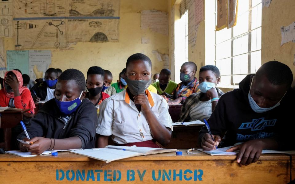 Uganda's students return to school after nearly two-year COVID-19 lockdown in Kyaka II Refugee Settlement - ESTHER RUTH MBABAZI /REUTERS 