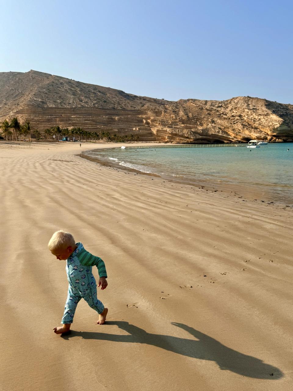 The author’s son, Julian, on the beach at Jumeirah Muscat Bay