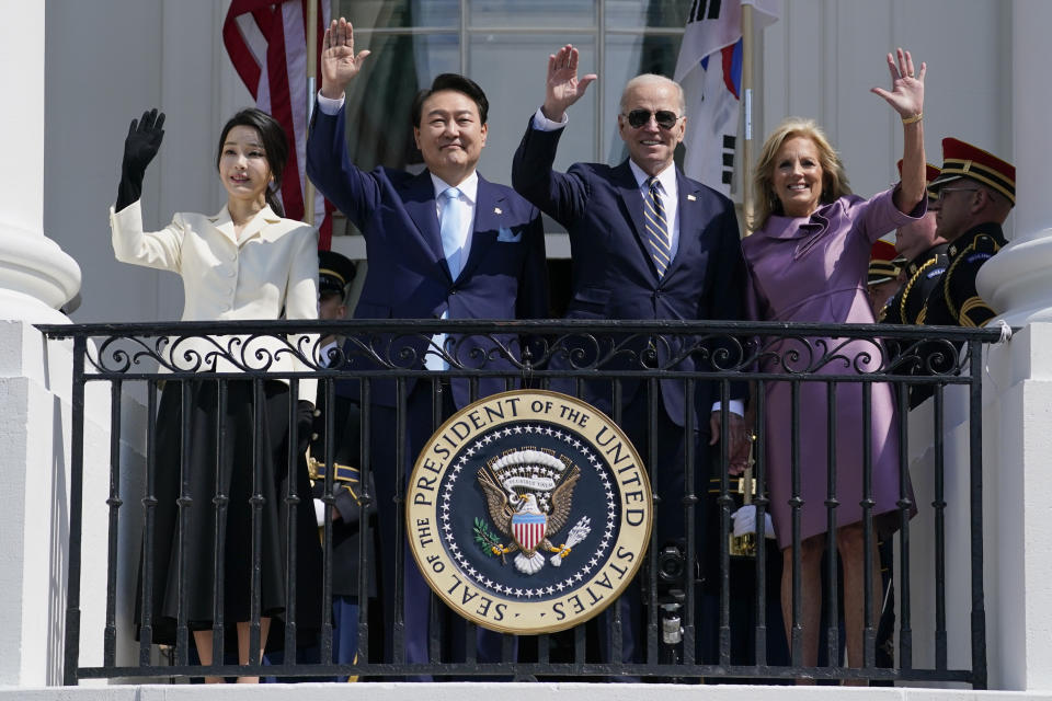 South Korea's first lady Kim Keon Hee, South Korea's President Yoon Suk Yeol, President Joe Biden and first lady Jill Biden wave from the Blue Room Balcony during a State Arrival Ceremony on the South Lawn of the White House Wednesday, April 26, 2023, in Washington. (AP Photo/Evan Vucci)