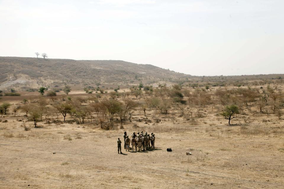 In this Tuesday Feb. 18, 2020, photo, Burkina Faso paratroopers commando exercise under the supervision of Dutch special forces during U.S. military-led annual counterterrorism exercise in Thies, Senegal. More than 1,500 service members from the armies of 34 African and partner training nations have assembled for the Flintlock exercises in Senegal and Mauritania, the two countries in West Africa's sprawling Sahel region that so far have not been hit by violence from extremists linked to al-Qaida or the Islamic State group. (AP Photo/Cheikh A.T Sy)