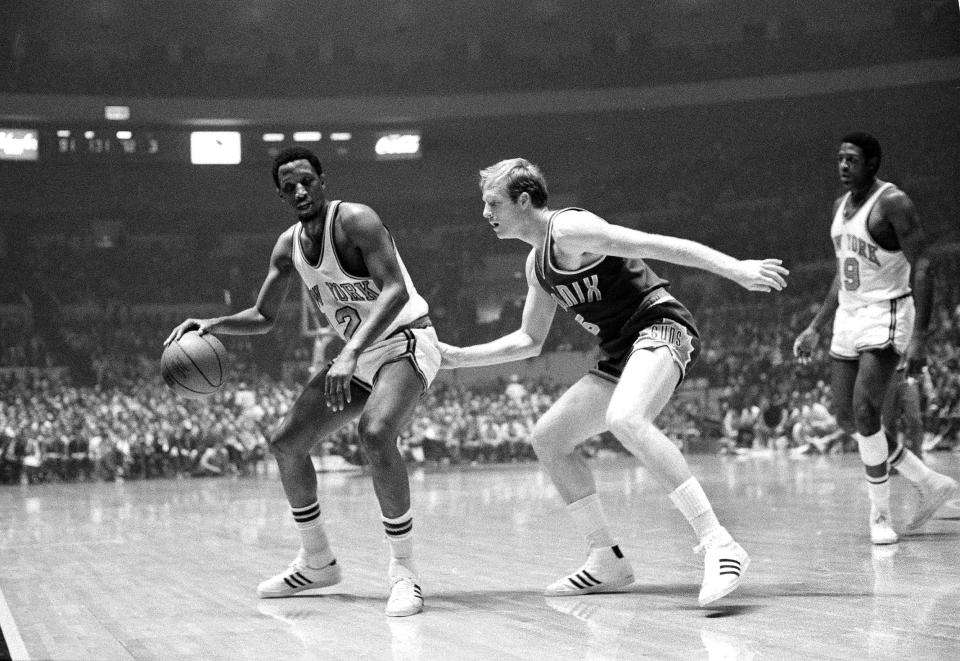 Dick van Arsdale, right, of the Phoenix Suns come in on the play from behind as New York Knicks' Dick Barnett prepares to move out with the ball in their game at New York's Madison Square Garden, Oct. 21, 1969. New York won, 140-116. (AP Photo/Ron Frehm)
