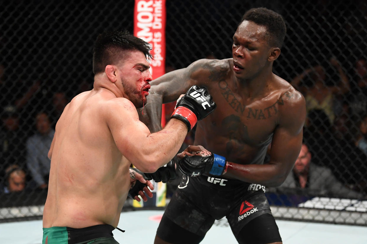 ATLANTA, GA - APRIL 13:  (R-L) Israel Adesanya punches Kelvin Gastelum in their interim middleweight championship bout during the UFC 236 event at State Farm Arena on April 13, 2019 in Atlanta, Georgia. (Photo by Josh Hedges/Zuffa LLC/Zuffa LLC via Getty Images)