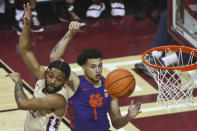 Florida State guard Darin Green, Jr. and Clemson guard Chase Hunter (1) position themselves for a rebound in the first half of an NCAA college basketball game in Tallahassee, Fla., Saturday, Jan. 28, 2023. (AP Photo/Phil Sears)