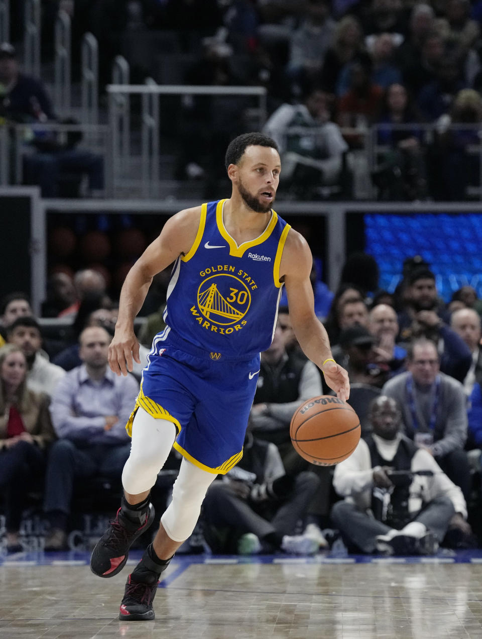 Golden State Warriors guard Stephen Curry brings the ball up court during the second half of an NBA basketball game against the Detroit Pistons, Monday, Nov. 6, 2023, in Detroit. (AP Photo/Carlos Osorio)