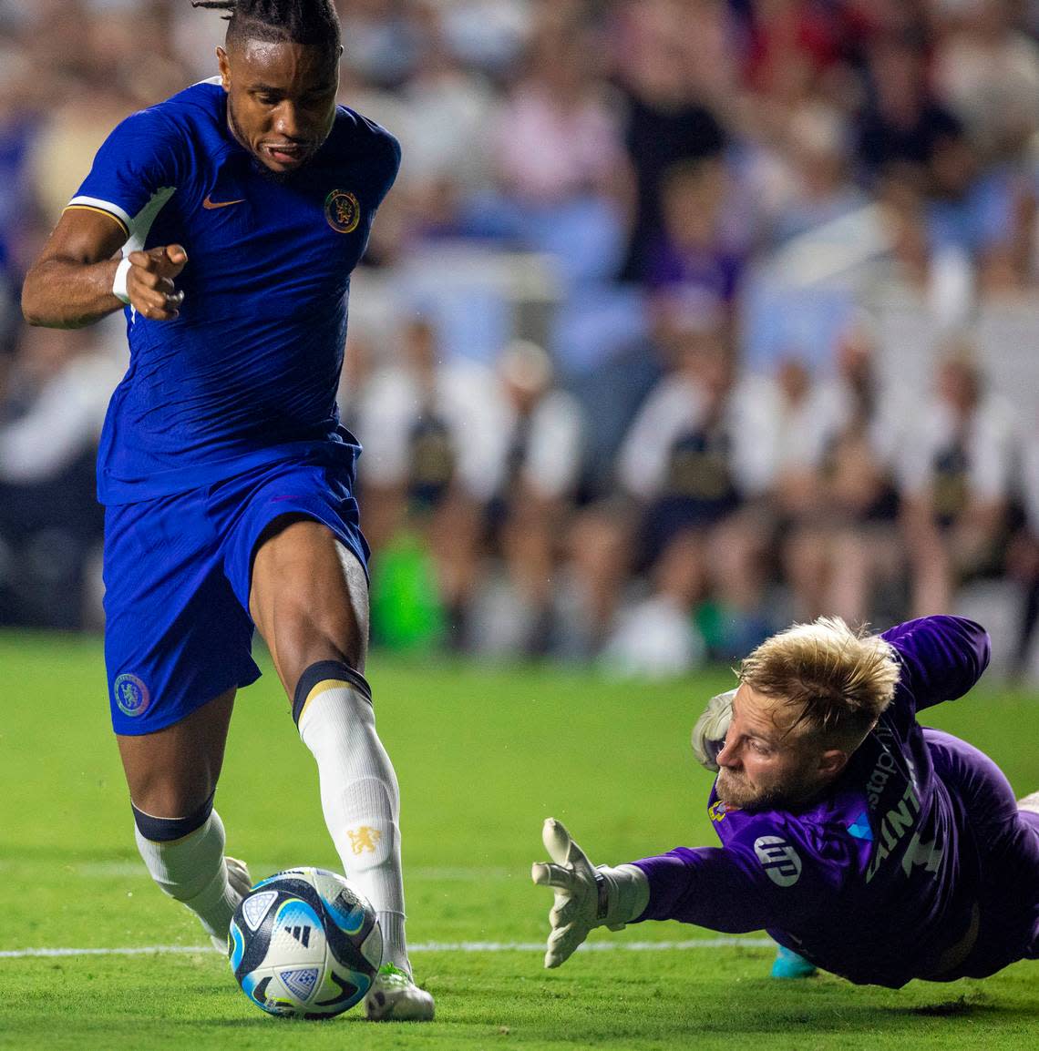 Chelsea’s Christopher Nkunku (45) scores on Wrexham goalie Rob Lainton (1) to take a 4-0 lead in the second half during their FC Series game on Wednesday, July 19, 2023 in Chapel Hill, N.C.