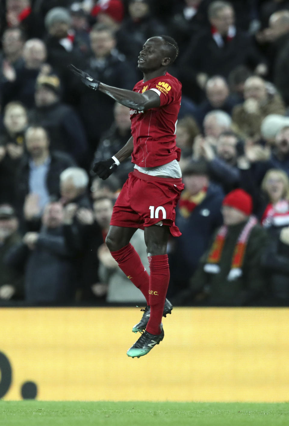 Liverpool's Sadio Mane celebrates after scoring his side's third goal during the English Premier League soccer match between Liverpool and Manchester City at Anfield stadium in Liverpool, England, Sunday, Nov. 10, 2019. (AP Photo/Jon Super)