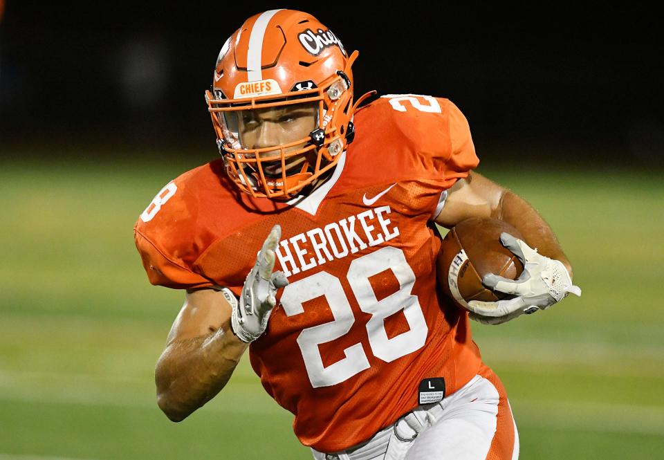 Cherokee's Brandon Boria (28) runs for a touchdown during Fridays football game against visiting Shawnee. The Chiefs defeated Shawnee 56-21. Oct. 8, 2021.