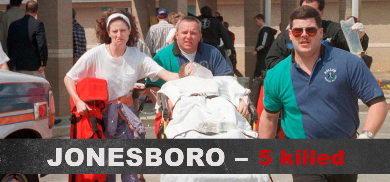 Emergency personnel rush an unidentified injured student to an ambulance at Westside Middle School near Jonesboro, Ark., March 24, 1998. (Photo: Curt Hodges/Jonesboro Sun)