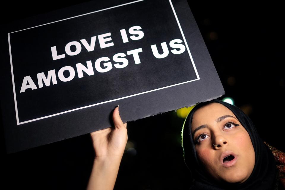 A Muslim woman displays a sign&nbsp;as she joins other human rights activists during a demonstration in New York on Dec. 10, 2015 in solidarity for Syrian and Iraqi refugees.