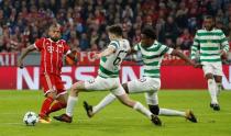 Soccer Football - Champions League - Bayern Munich vs Celtic - Allianz Arena, Munich, Germany - October 18, 2017 Bayern Munich's Arturo Vidal in action with Celtic’s Kieran Tierney and Dedryck Boyata REUTERS/Michaela Rehle