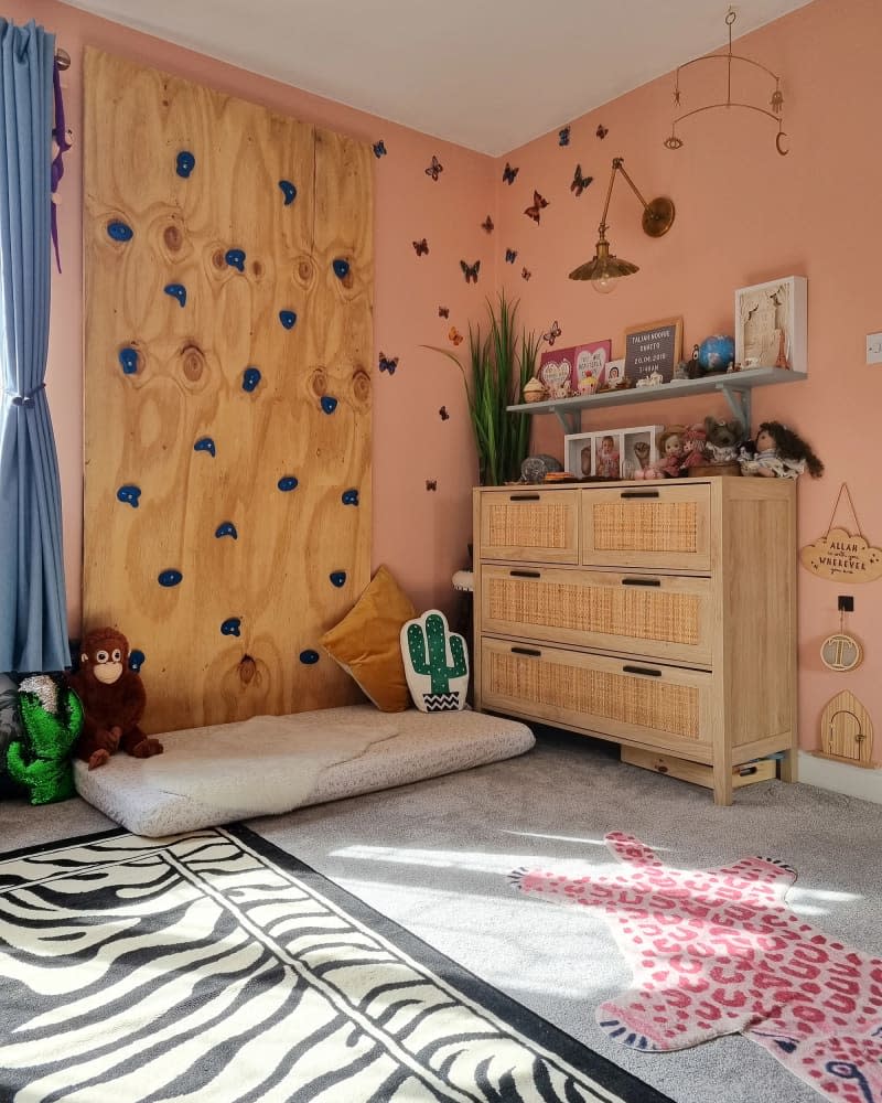 Weaved wooden front dresser in child's room.