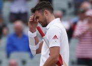 England's James Anderson reacts to losing the second Ashes cricket test against Australia at the Adelaide Oval December 9, 2013. Australia captured England's four remaining wickets before lunch to close out an emphatic 218-run victory in the second Ashes test on Monday. REUTERS/David Gray (AUSTRALIA - Tags: SPORT CRICKET)