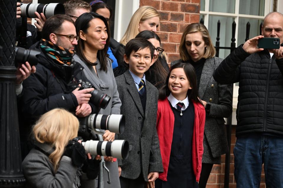 Lucy Hunt, second left the wife of Britain’s Chancellor of the Exchequer Jeremy Hunt with two of her children watch as he leaves 11 Downing Street for the House of Commons to deliver the Budget In London (Jeremy Selwyn)