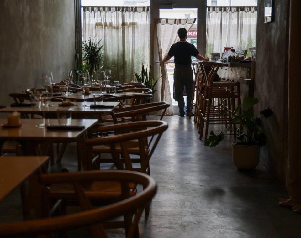 Chef Juan Camilo Liscano returns back to his roots in Miami as he stands at the front door of his restaurant Palma.