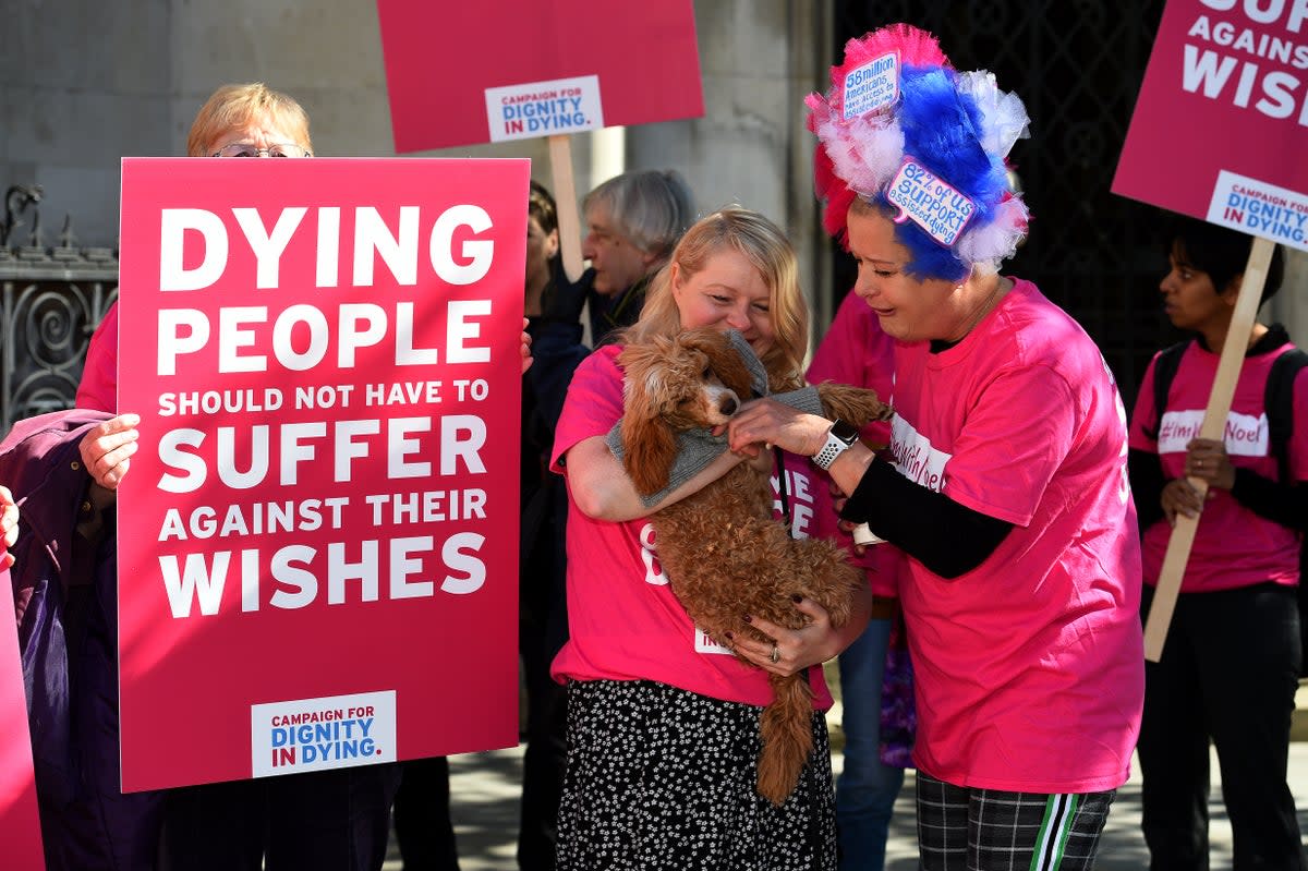 Activists from the Campaign for Dignity in Dying outside the Royal Courts of Justice in London in 2018 (PA)