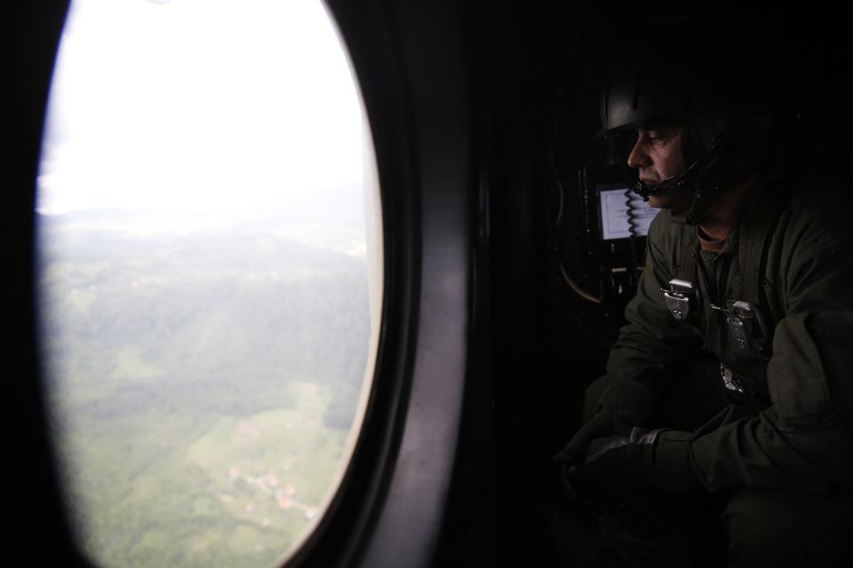 A member of the Armed Forces of Bosnia and Herzegovina views the flooded city of Gracanica