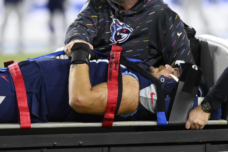 Tennessee Titans offensive tackle Taylor Lewan is taken off the field after being injured in the first half of an NFL football game against the Buffalo Bills Monday, Oct. 18, 2021, in Nashville, Tenn. (AP Photo/Mark Zaleski)