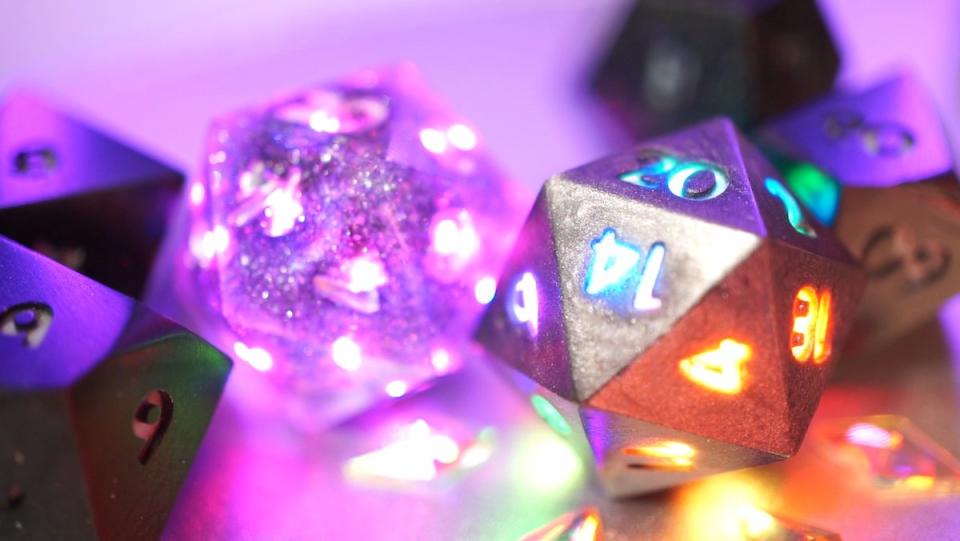 A close look at Pixels Electronic Dice, glowing and sparkling