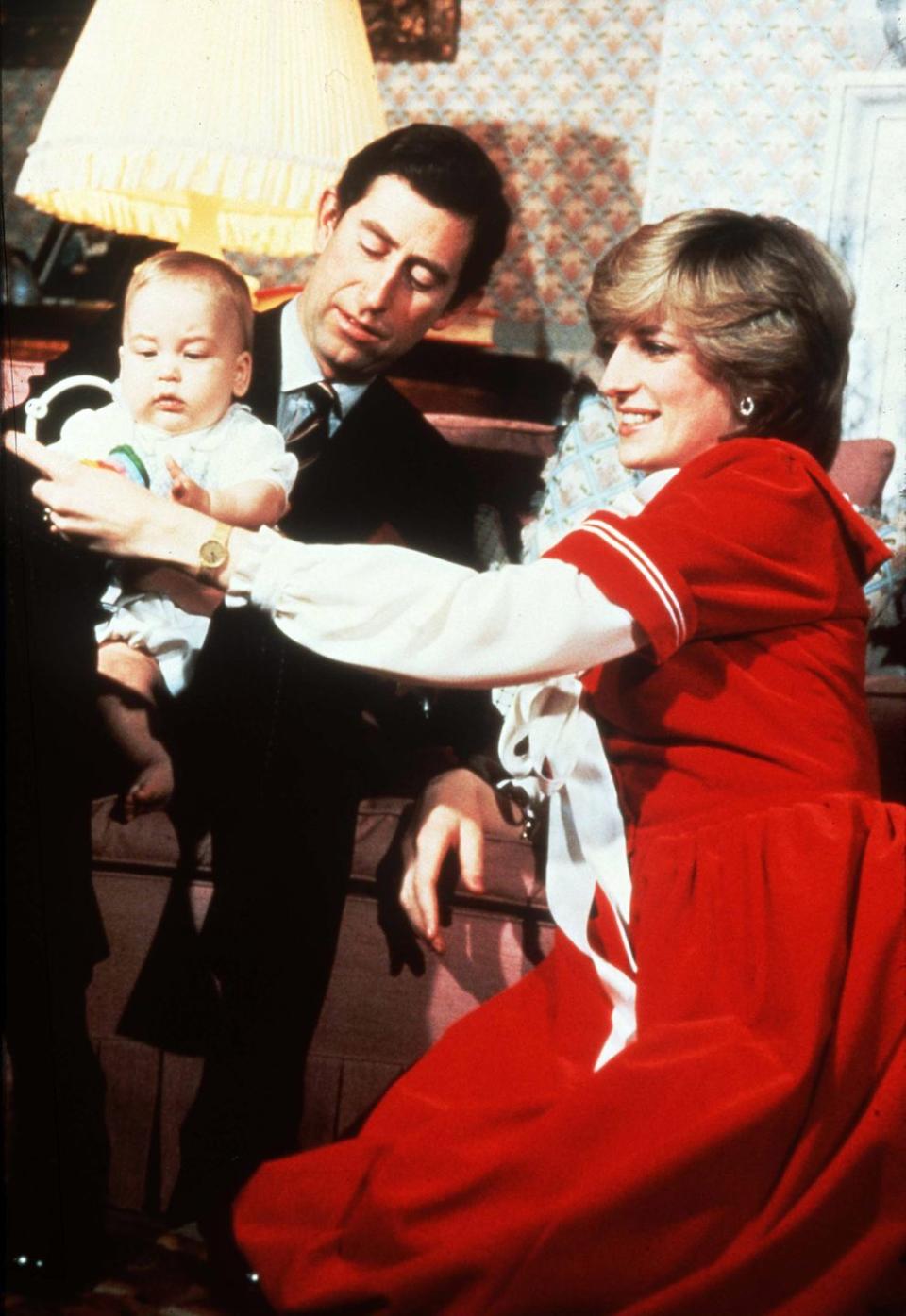 <p>Here, Diana, Prince Charles, and a nearly six-month-old Prince William are enjoying the Christmas season at <a href="https://www.veranda.com/decorating-ideas/house-tours/g33968258/princess-dianas-kensington-palace/" rel="nofollow noopener" target="_blank" data-ylk="slk:their private quarters in Kensington Palace;elm:context_link;itc:0;sec:content-canvas" class="link ">their private quarters in Kensington Palace</a>. Diana is decked out in a sailor-inspired, cherry-red dress that feels festive and cheery. </p>