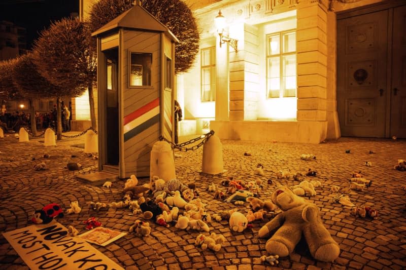 Protesters lay down stuffed animals during a protest against Hungarian President Katalin Novak decision to pardon a man in a case of child sexual abuse. Marton Monus/dpa