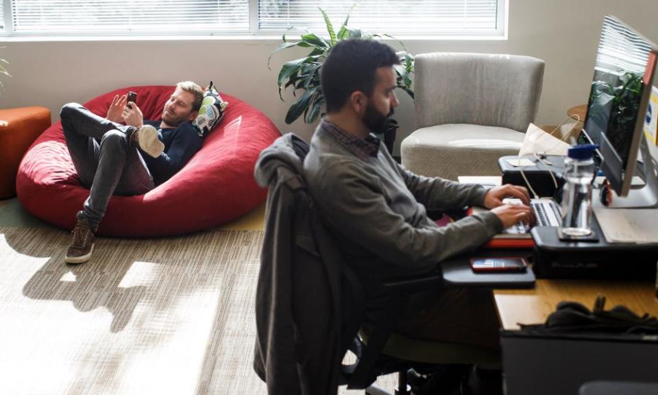 People work in the office of NGIN, a co-working space, in Cambridge, Massachusetts