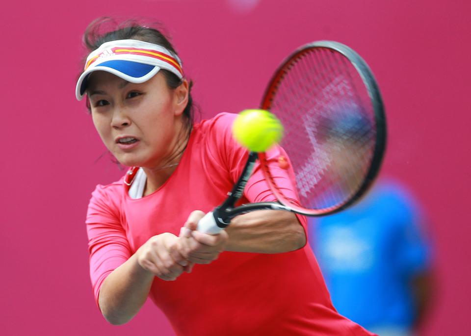 Peng Shuai of China hits a return against Sara Sorribes Tormo of Spain during their women's singles quarter-final match at the WTA Tianjin Open tennis tournament in Tianjin on October 13, 2017. / AFP PHOTO / STR / China OUT        (Photo credit should read STR/AFP via Getty Images)