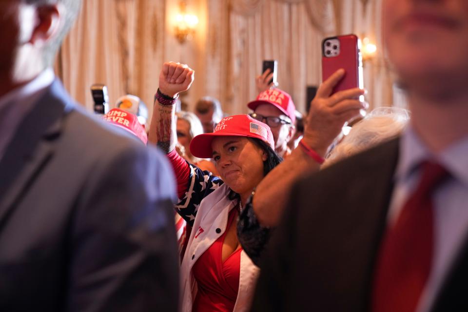 People cheer as former President Donald Trump announces a third run for president as he speaks at Mar-a-Lago in Palm Beach, Fla., Tuesday, Nov. 15, 2022.