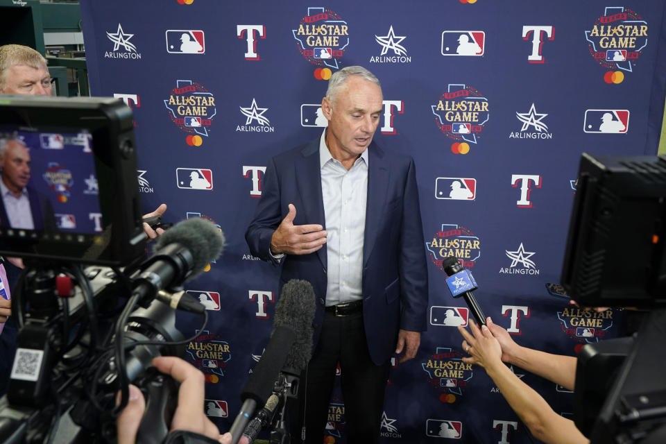 Major League Baseball Commissioner Rob Manfred responds to questions during a news conference after unveiling of the 2024 All-Star game logo, Thursday, July 20, 2023, in Arlington, Texas. The MLB All-Star Game has grown into a truly Texas-sized event since the last time the Rangers hosted the midsummer classic. The countdown is on for 2024 game on July 16, and all of the activities around the game. (AP Photo/Tony Gutierrez)