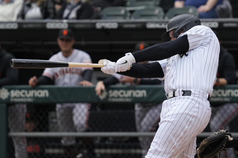 Chicago White Sox's Andrew Vaughn hits a one-run double during the first inning of a baseball game against the San Francisco Giants in Chicago, Wednesday, April 5, 2023. (AP Photo/Nam Y. Huh)