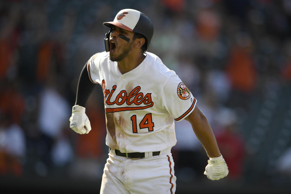 Baltimore Orioles' Rio Ruiz reacts towards the dugout on his way to first to round the bases after he hit a two-run walkoff home run in a baseball game against the Houston Astros, Sunday, Aug. 11, 2019, in Baltimore. The Orioles won 8-7. (AP Photo/Nick Wass)