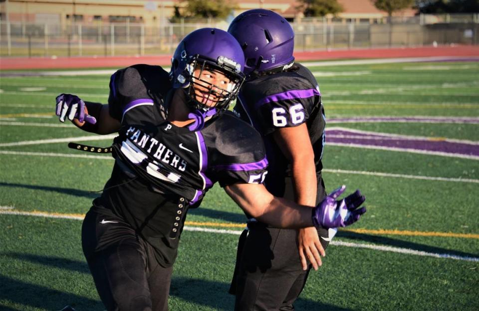 Pacheco High School junior Payton Mosley (55) participates in defensive drills during practice on Wednesday, Aug. 2, 2023 at Pacheco High School in Los Banos, Calif.