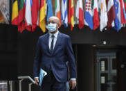 European Council President Charles Michel arrives for a media conference following an EU summit in video conference format at the European Council building in Brussels, Wednesday, Aug. 19, 2020. European Union leaders on Wednesday said they stand beside people in Belarus protesting for their democratic rights, underlining that the EU rejects the election results that swept President Alexander Lukashenko back into power and is preparing a list of several people that face sanctions over vote fraud and the crackdown that followed. (Olivier Hoslet, Pool Photo via AP)