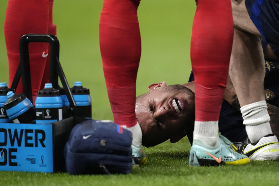France's Lucas Hernandez is seen down injured during the World Cup group D soccer match between France and Australia, at the Al Janoub Stadium in Al Wakrah, Qatar, Tuesday, Nov. 22, 2022. (AP Photo/Christophe Ena)