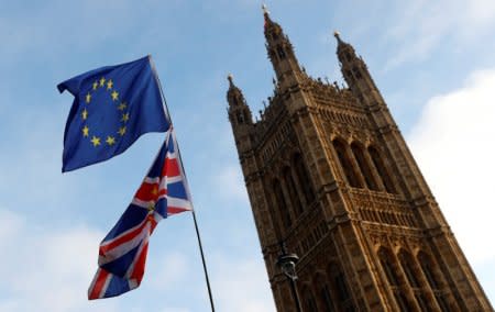 Protesters wave the EU and Union flags outside the Palace of Westminster, London, Britain, December 20, 2017. REUTERS/Peter Nicholls