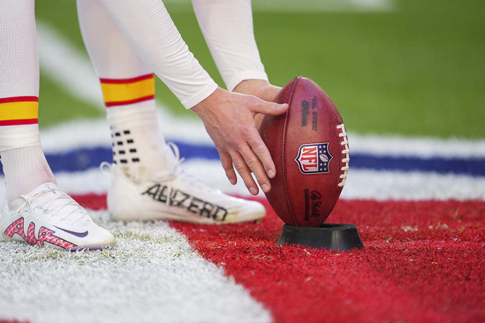 Harrison Butker of the Kansas City Chiefs with Adidas on the left foot and Nike on the right. - Credit: Cooper Neill/Getty Images