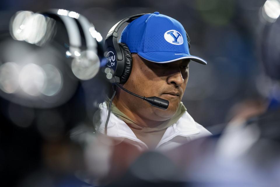 BYU coach Kalani Sitake is pictured here during a timeout during the game against the Iowa State Cyclones at LaVell Edwards Stadium.