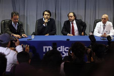 Andres Manuel Lopez Beltran (2nd L), son of Mexican leftist leader Andres Manuel Lopez Obrador, speaks during a news conference at Medica Sur hospital in Mexico City December 3, 2013. From L-R: Lopez Obrador's spokesman Cesar Yanez, Lopez Beltran and cardiologists Patricio Ortiz and Octavio Gutierrez. REUTERS/Tomas Bravo