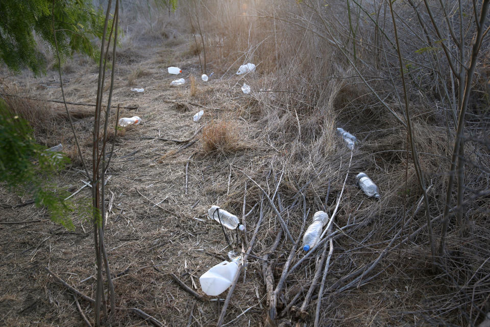 <p>Refuse left by undocumented immigrants and smugglers litters a brush path near the U.S.-Mexico border on April 11, 2013, in La Joya, Texas. (Photo: John Moore/Getty Images) </p>