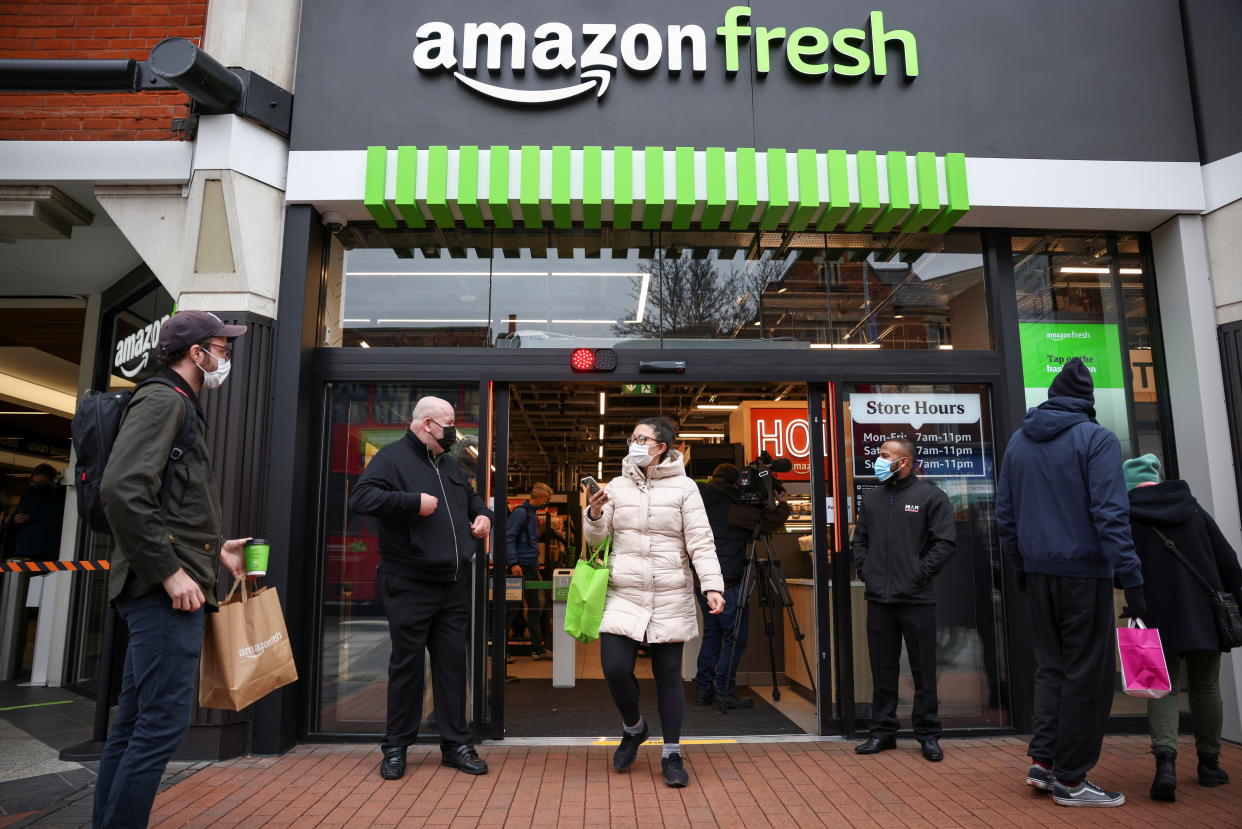 A shopper leaves the UK's first Amazon Fresh supermarket in London, Britain, March 4, 2021. REUTERS/Henry Nicholls