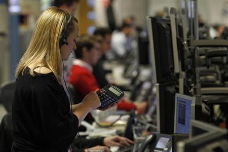 A trader works on the trading floor in London January 22, 2010. REUTERS/Stefan Wermuth