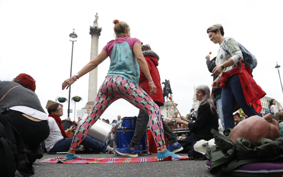 Demonstrators block Trafalgar Square in central London Monday, Oct. 7, 2019. Extinction Rebellion movement blocked major roads in London, Berlin and Amsterdam on Monday at the beginning of what was billed as a wide-ranging series of protests demanding new climate policies. (AP Photo/Alastair Grant)