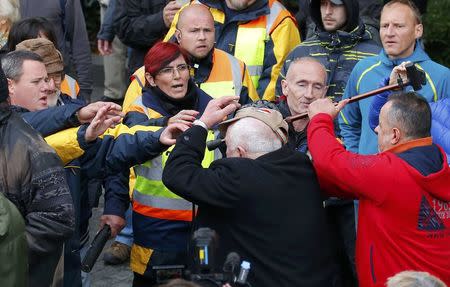 Pro- and anti-government supporters scuffle near a ceremony marking the 60th anniversary of 1956 anti-Communist uprising in Budapest, Hungary, October 23, 2016. REUTERS/Laszlo Balogh