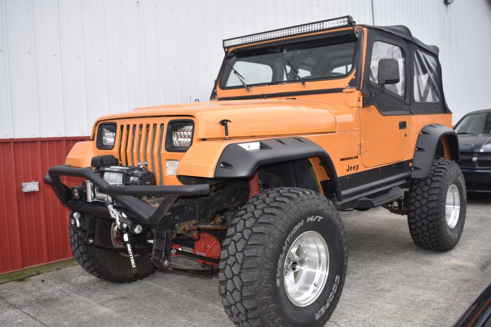 Brian Green's 1991 Jeep Wrangler parked at Advanced Auto Care in Bloomington, where he works.