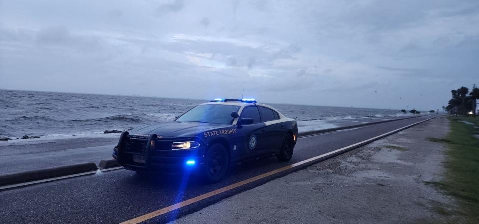 A state trooper sits by the Sunshine Skyway Bridge, as weather conditions there deteriorate (FHP Tampa)