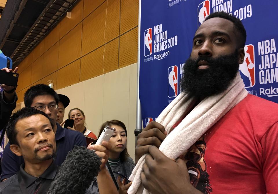 US player James Harden (R) of the National Basketball Association's (NBA) Houston Rockets speaks to the media after a training session in Tokyo on October 6, 2019, ahead of their exhibition games against NBA champions Toronto Raptors. (Photo by Natsuko FUKUE / AFP) (Photo by NATSUKO FUKUE/AFP via Getty Images)